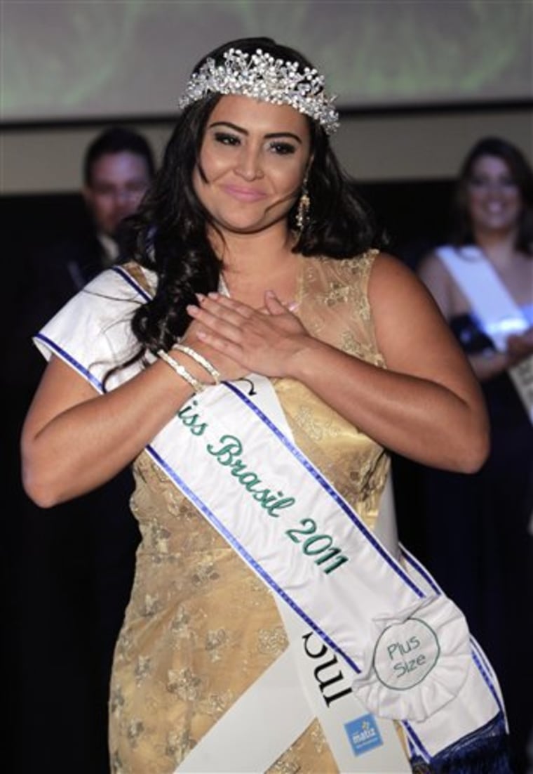 Contestant Barbara Monteiro, from Brazil's Mato Grosso do Sul state, gestures after winning the Miss Brazil Plus Size Beauty Pageant in Sao Paulo, Brazil, Monday, Jan. 30, 2012. A growing number of bikini and swimming suits manufacturers have woken up to Brazil's thickening waistline and are reaching out to the ever-expanding ranks of heavy women with new plus-size lines. (AP Photo/Andre Penner)